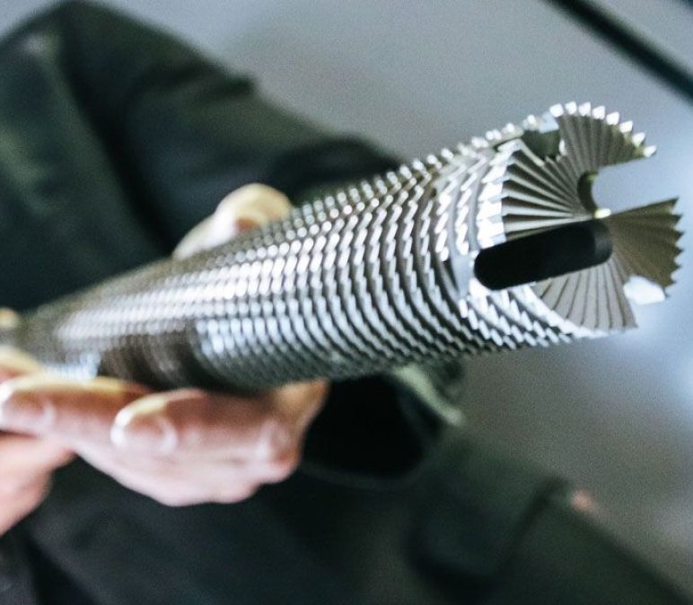 worker holds a precision cutter